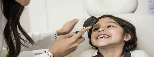 Young boy gets his eyes examined